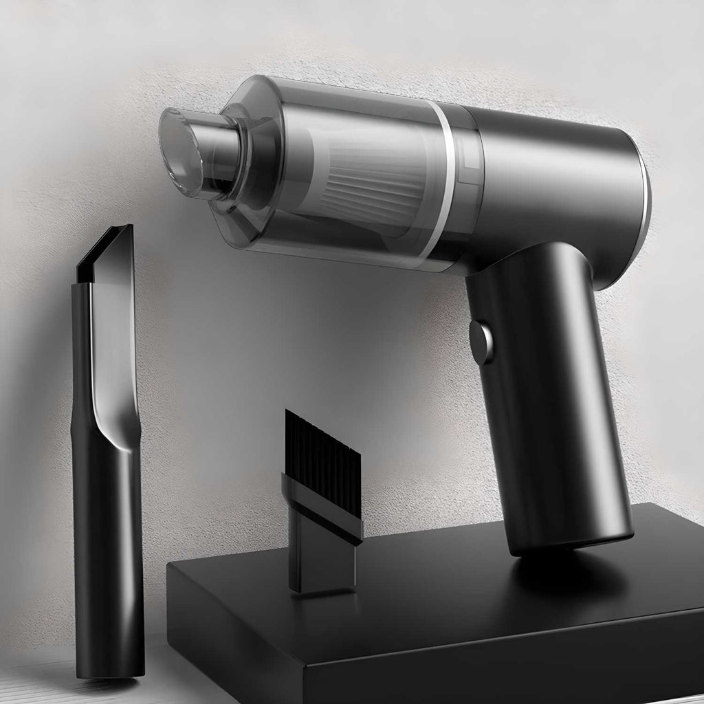 Black and silver handheld vacuum cleaner with attachments on a light gray background